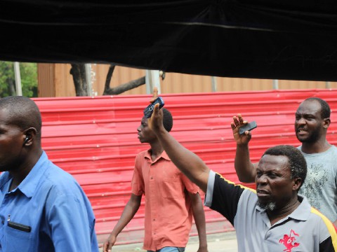Crowd uses cell phones to document the protest