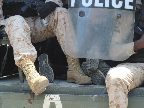 Heavily Armed use toxic sprayed gas, rubber bullet & teargas 